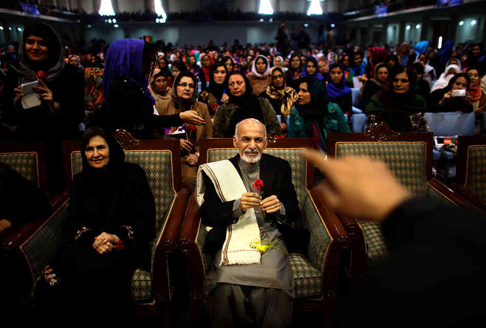 Presidential candidate Ashraf Ghani holds a rose during a campaign rally in the Afghan capital Kabul. Ghani, a former finance minister, is a leading contender in Saturday's vote. President Hamid Karzai is stepping down and the country is poised to have its first-ever democratic transition of power. Presidential candidate Ashraf Ghani holds a rose during a campaign rally in the Afghan capital Kabul. Ghani, a former finance minister, is a leading contender in Saturday's vote. President Hamid Karzai is stepping down and the country is poised to have its first-ever democratic transition of power.