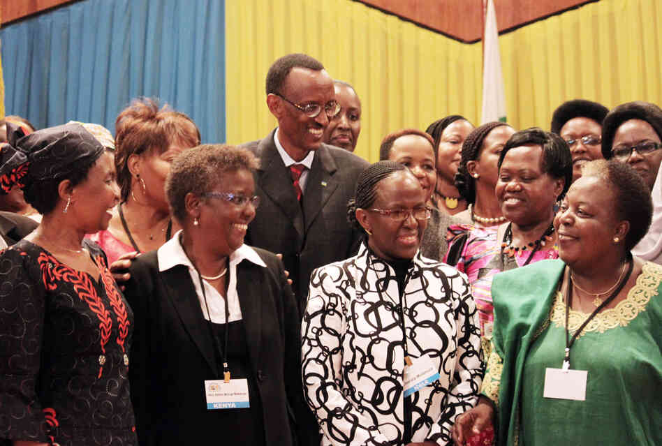 Rwandan President Paul Kagame (center) takes part in a group photo at a conference on the role of women at the nation's parliament in Kigali, Rwanda, in 2010. Rwandan President Paul Kagame (center) takes part in a group photo at a conference on the role of women at the nation's parliament in Kigali, Rwanda, in 2010.