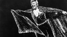 Liberace flies over the stage in the grand finale of a Las Vegas performance in 1974. Liberace flies over the stage in the grand finale of a Las Vegas performance in 1974.
