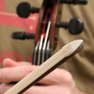 Antique bows were often made with a small piece of ivory that clamps the bow hairs onto the wood. Antique bows were often made with a small piece of ivory that clamps the bow hairs onto the wood.