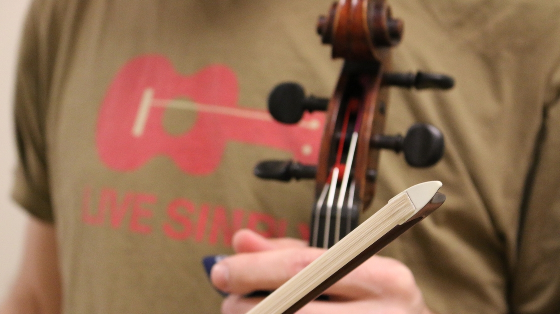 Antique bows were often made with a small piece of ivory that clamps the bow hairs onto the wood.