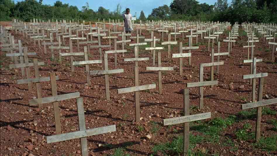 A young Rwandan girl walks through Nyaza cemetery outside Kigali, Rwanda, in 1996, where thousands of victims of the 1994 genocide are buried. The three months of ethnic violence left 800,000, mostly Tutsis, dead. A young Rwandan girl walks through Nyaza cemetery outside Kigali, Rwanda, in 1996, where thousands of victims of the 1994 genocide are buried. The three months of ethnic violence left 800,000, mostly Tutsis, dead.