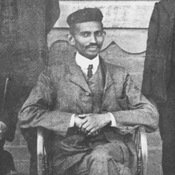 Mohandas Gandhi, center, sits with co-workers at his Johannesburg law office in 1902.