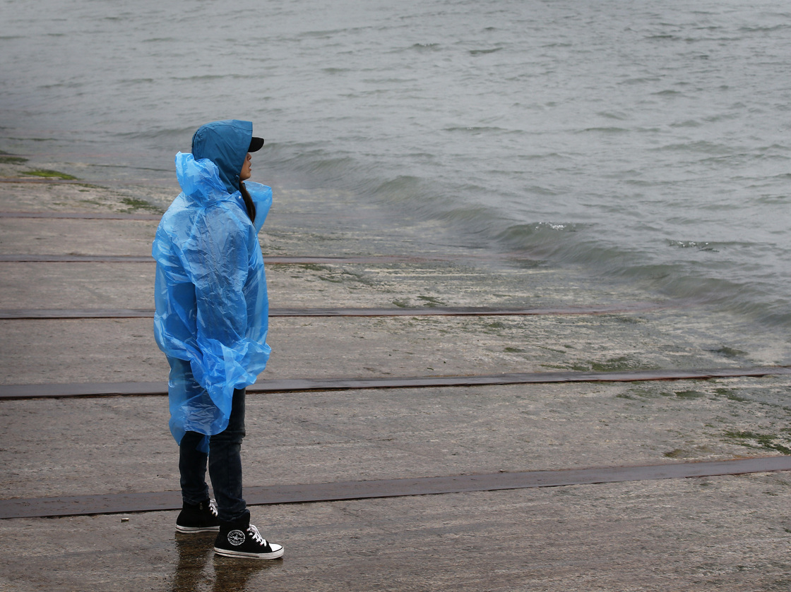 Holding out hope, fearing the worst: A man looks out from the shore in Jindo, South Korea, toward where a passenger ferry sank Wednesday and nearly 300 people are still missing.