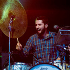 Sean Carey, who writes and records as S. Carey, performing live with Bon Iver. Sean Carey, who writes and records as S. Carey, performing live with Bon Iver.