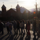 The faithful follow penitentes — lay members of a Catholic brotherhood — to Mass at Holy Cross Catholic Church in Santa Cruz, N.M., on Holy Thursday in 2013. The faithful follow penitentes — lay members of a Catholic brotherhood — to Mass at Holy Cross Catholic Church in Santa Cruz, N.M., on Holy Thursday in 2013.