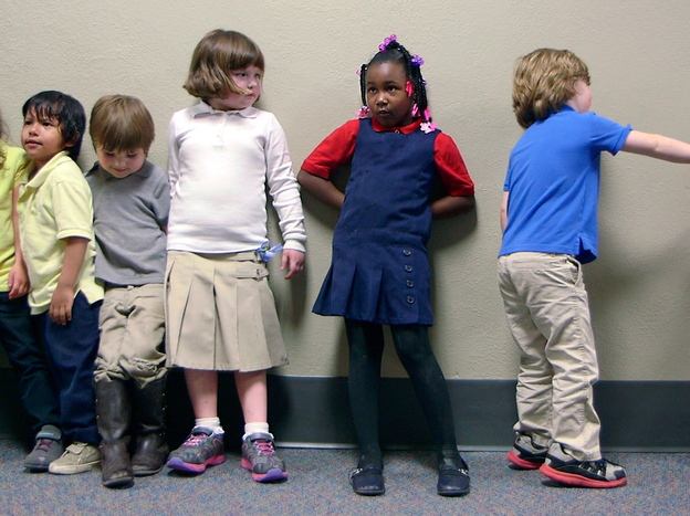 Preschool students from Nikki Jones's class at Porter Early Childhood Development Center in Tulsa line up in the hallway on their way back from outside play. (Image credit: NPR)
