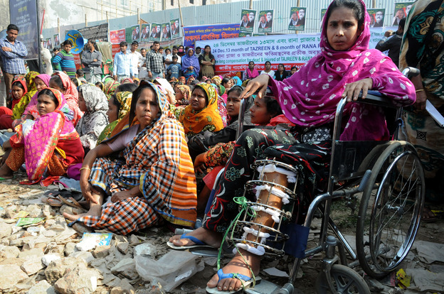 Garment workers and relatives of Rana Plaza victims stage a demonstration on the outskirts of Dhaka, Bangladesh, Dec. 24. (Image credit: Xinhua/Landov)