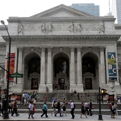 Pedestrians walk past the main branch of the New York Public Library in New York City in this 2013 photo.