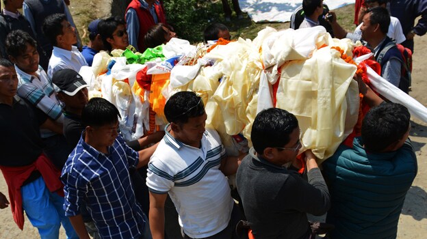 Relatives carry a casket bearing the body of a Mount Everest avalanche victim for cremation in Kathmandu on Monday. (Image credit: AFP/Getty Images)
