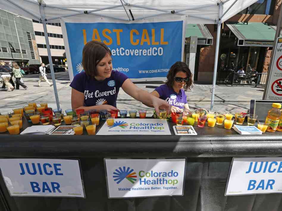 Lauren Farnsworth (left) and April Buell hand out literature in late March encouraging people to get health coverage under the Affordable Care Act. Lauren Farnsworth (left) and April Buell hand out literature in late March encouraging people to get health coverage under the Affordable Care Act.