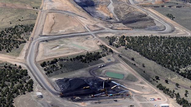 Some universities have stopped investing in coal companies, but many others don't see the point. An aerial view of the Coal Hollow Mine in Utah in 2012. (Image credit: Getty Images)