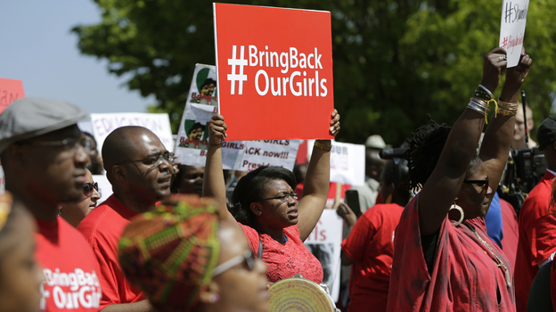 Protesters march in front of the Nigerian Embassy in Washington, D.C., on Tuesday in support of the girls kidnapped by members of the Islamist group Boko Haram. (Image credit: Reuters/Landov)