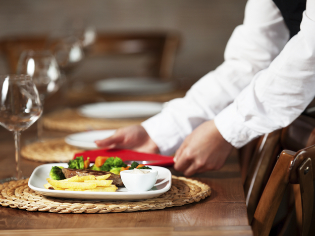 Most restaurant workers don't get paid when they stay home sick, so many report to work anyway. (Image credit: iStockphoto)