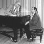 Carl decides to take a publicity photo shoot up a notch while Peter tickles the ivories. Carl decides to take a publicity photo shoot up a notch while Peter tickles the ivories.