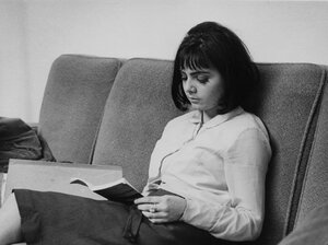 A student buries herself in a book in the Shaw Library at the British Library of Political and Economic Science in 1964.