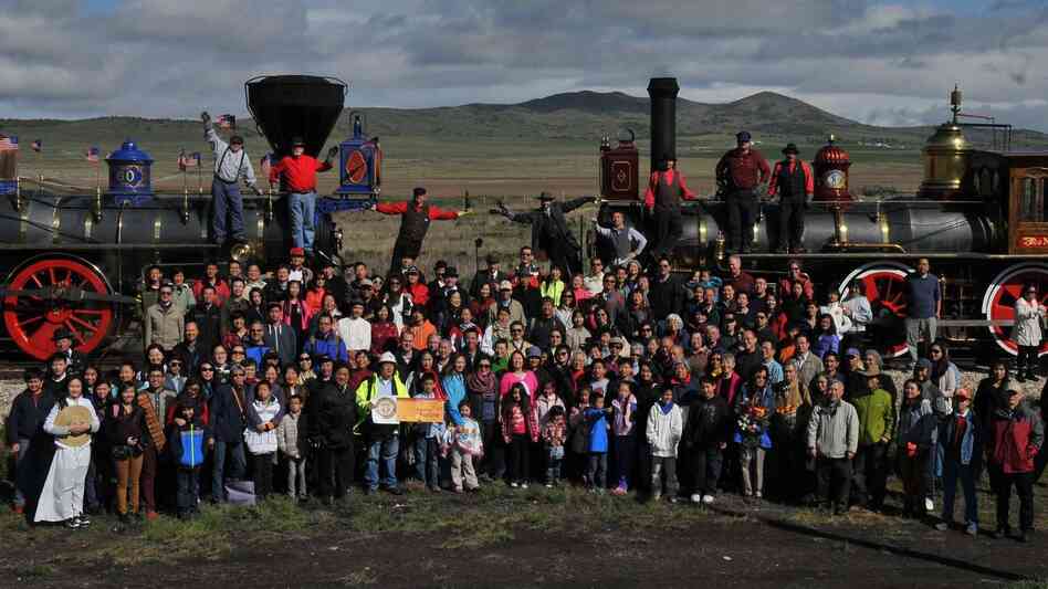 A group of Asian-Americans, including descendants of Chinese railroad workers, recreated an iconic photo on the 145th anniversary of the first transcontinental railroad's completion at Promontory Summit, Utah. A group of Asian-Americans, including descendants of Chinese railroad workers, recreated an iconic photo on the 145th anniversary of the first transcontinental railroad's completion at Promontory Summit, Utah.