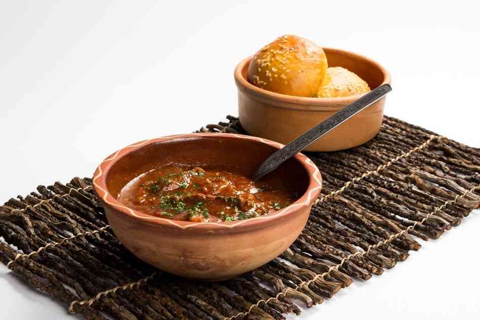 Janija, a tomato-based beef and vegetable stew that is eaten with bread, is one of cook Djevrija Mazrek's favorite dishes. Janija, a tomato-based beef and vegetable stew that is eaten with bread, is one of cook Djevrija Mazrek's favorite dishes.