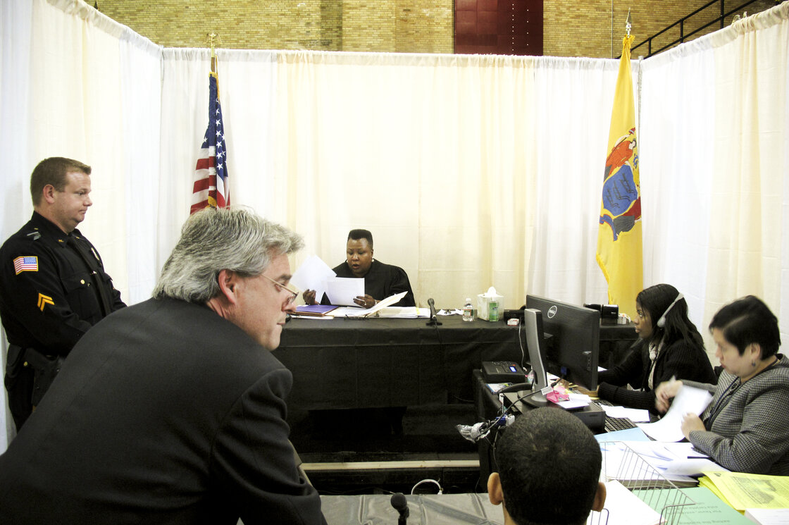 Makeshift courtrooms were set up inside the armory for judges to review each case. Makeshift courtrooms were set up inside the armory for judges to review each case.