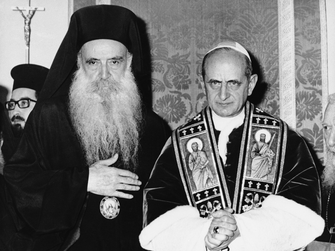 Pope Paul VI of the Roman Catholic Church and bearded Orthodox Patriarch Athenagoras of Constantinople pose during a historic meeting on Jan. 8, 1964, on the Mount of Olives in a part of Jerusalem that was controlled by Jordan at the time. It was the first meeting between leaders of the split church since the East-West Schism of 1054.