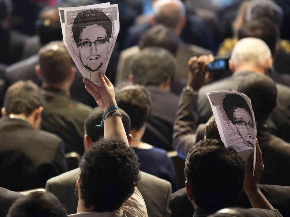 Participants hold up images of former NSA analyst Edward Snowden at an April conference on the future of Internet governance in Sao Paulo, Brazil. Participants hold up images of former NSA analyst Edward Snowden at an April conference on the future of Internet governance in Sao Paulo, Brazil.