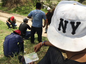Marlon, a 15-year-old from El Salvador, studies a map of freight train schedules while en route to the U.S. border, outside Huehuetoca in central Mexico. Traveling alone, Marlon says he has heard that if he can make it into the U.S., he can go live with his grandmother, who is a permanent resident in Los Angeles — a belief that drives many people trying to cross the U.S.-Mexico border.