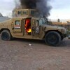 A cellphone photo shows an armored vehicle belonging to Iraqi security forces in flames Tuesday, after hundreds of militants launched a major assault in Mosul. Some 500,000 Iraqis have fled their homes in the large city since militants took control. A cellphone photo shows an armored vehicle belonging to Iraqi security forces in flames Tuesday, after hundreds of militants launched a major assault in Mosul. Some 500,000 Iraqis have fled their homes in the large city since militants took control.