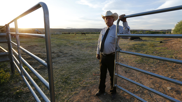 Rancher Cliven Bundy stands near a gate on his 160-acre ranch in Bunkerville, Nev., the site of a standoff with the government last month. If the federal government comes back, Bundy promises, his militia supporters will also return in force. (Image credit: Reuters /Landov)