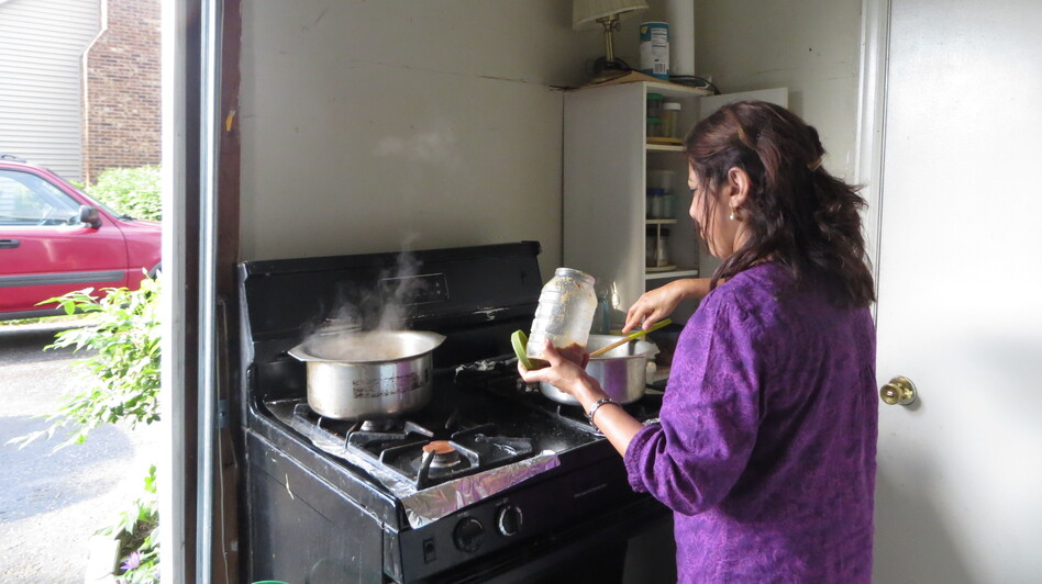 Tahira Ahmed sometimes cooks in a makeshift kitchen in her garage. Her daughter loves her cooking, but has resisted learning to cook her mother's signature Pakistani dishes.