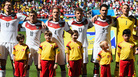 German soccer players sing their national anthem Monday before their 2014 World Cup match against Portugal in Salvador, Brazil. German soccer players sing their national anthem Monday before their 2014 World Cup match against Portugal in Salvador, Brazil.