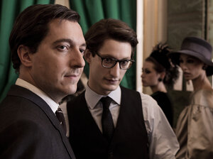 The film depicts the relationship between Pierre Berge (Guillaume Gallienne, left) and Yves Saint Laurent (Pierre Niney) as both interactive and supportive.