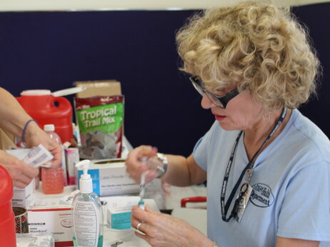 Jacqueline Fletcher readies a measles vaccine to give at a makeshift clinic in central Ohio. About 8,000 Amish people in the area have received measles vaccinations since April. Jacqueline Fletcher readies a measles vaccine to give at a makeshift clinic in central Ohio. About 8,000 Amish people in the area have received measles vaccinations since April.