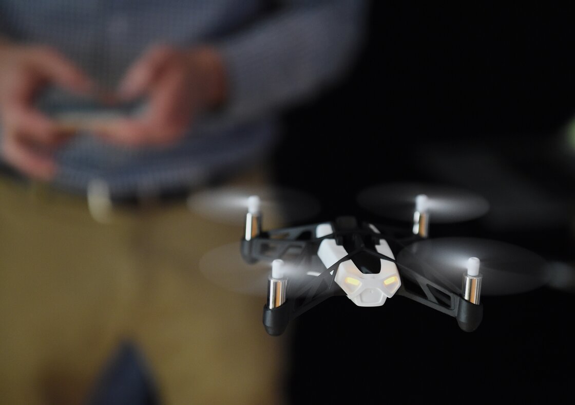 Technology journalist Tim Stenovec controls a Parrot Minidrone "Rolling Spider" during a demonstration in June in New York.