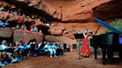 At the Moab Music Festival in Utah, summer night performances take place in picturesque settings. At the Moab Music Festival in Utah, summer night performances take place in picturesque settings.