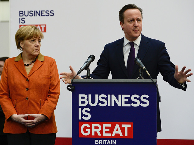 British Prime Minister David Cameron delivers a speech next to German Chancellor Angela Merkel at a technology Trade fair March 10 in Hanover, Germany. (Image credit: Getty Images)