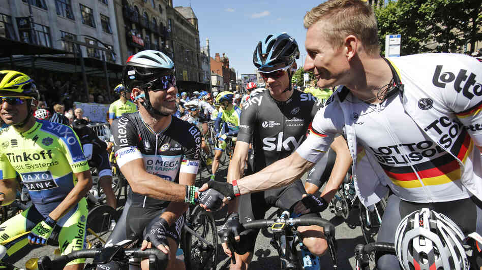 Sprinters Mark Cavendish of Britain (second left) and Germany's Andre Greipel, (right) shake hands as Britain's Christopher Froome (second right) and Spain's Alberto Contador (left) wait for the start of the first stage of the Tour de France on Saturday. Sprinters Mark Cavendish of Britain (second left) and Germany's Andre Greipel, (right) shake hands as Britain's Christopher Froome (second right) and Spain's Alberto Contador (left) wait for the start of the first stage of the Tour de France on Saturday.