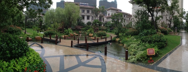Villas in a luxury compound in Wuxi, in China's eastern Jiangsu province, sit empty after a year while more apartment blocks rise in the distance. (Image credit: NPR)