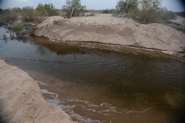 Twelve hours after they had halted at the river's end, the team woke up to see that the previous night's small stream had become a river. Two weeks after this photo was taken, the leading edge of the water reached the estuary that was the river's final destination. (Image credit: Courtesy Fred Phillips)