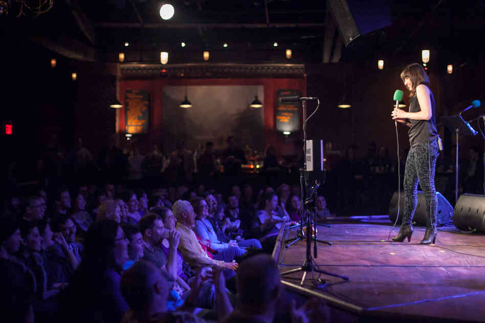 Ask Me Another host Ophira Eisenberg on stage at The Bell House in Brooklyn, N.Y. Ask Me Another host Ophira Eisenberg on stage at The Bell House in Brooklyn, N.Y.