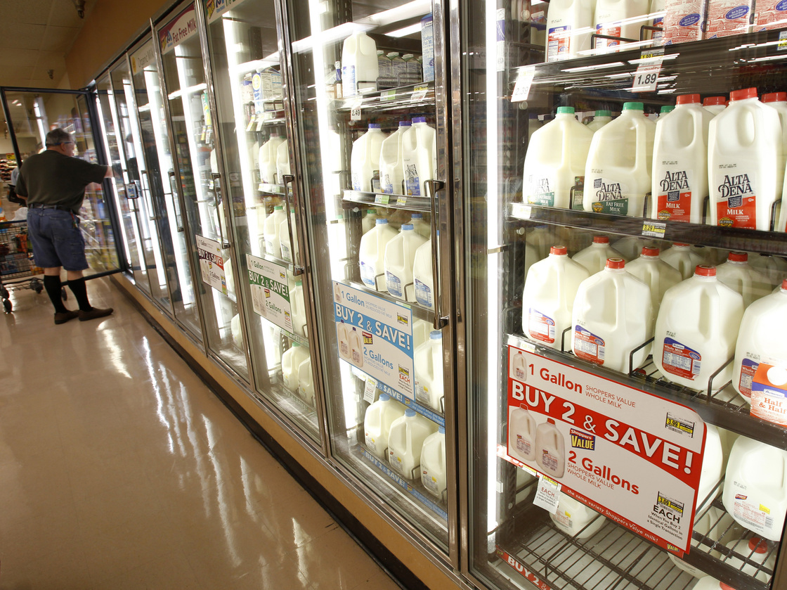 The milk section of a grocery store.