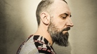 Fin Greenall, the singer-songwriter behind the band Fink, began his music career as a DJ. Fin Greenall, the singer-songwriter behind the band Fink, began his music career as a DJ.
