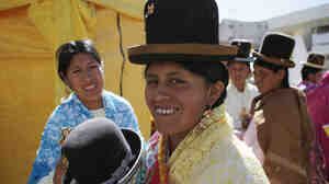 An Aymara woman prepares to take part in a pageant in La Paz, Bolivia, in 2013. Jaqi-Aru, a community of volunteers is working on translating the Facebook interface in the indigenous language of Aymara.