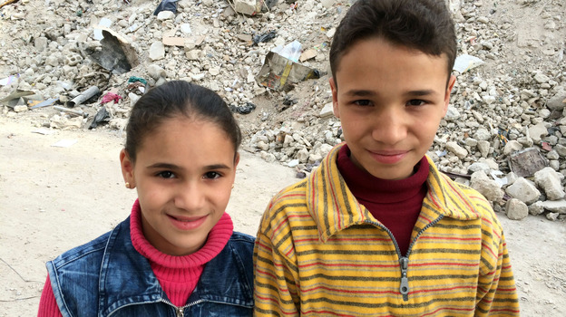 Kifah, 13, poses with his sister in Damascus. Kifah is one of six Syrian children profiled in a new BBC documentary. (Image credit: BBC)