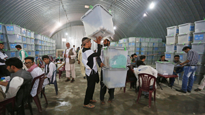Afghan election workers are auditing all 8 million votes, which fill 23,000 ballot boxes, from the country's June 14 presidential runoff. The process will take weeks and is being slowed by the constant disputes between teams representing the two candidates.
