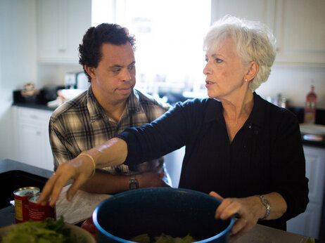 Justin and his mother, Annamarie McCowan, make a salad together. Justin and his mother, Annamarie McCowan, make a salad together.