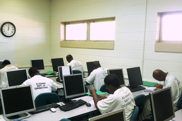 Inmates from several Alabama state prisons take a math class at J.F. Ingram State Technical College. The campus becomes a medium-security facility when the students arrive. (Image credit: WBHM)