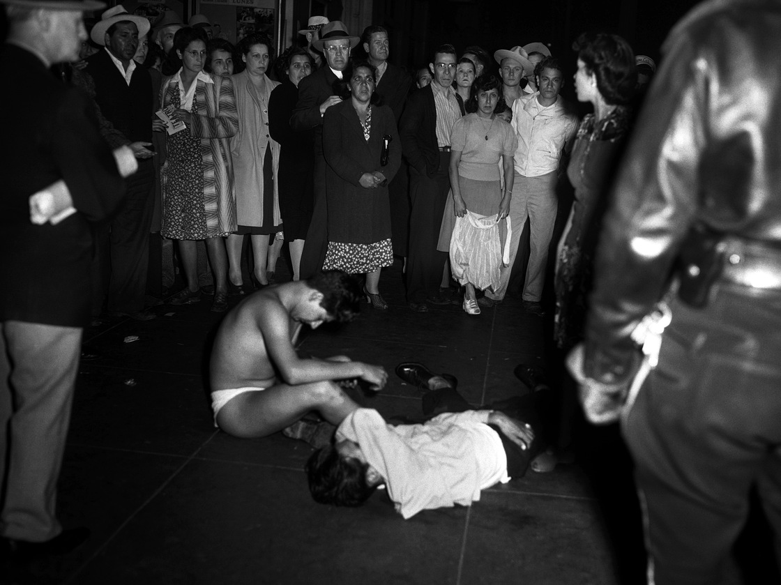 Young men were stripped of their clothes and badly beaten as policemen scoured the streets in Los Angeles for zoot-suited young men they blamed for petty crime.