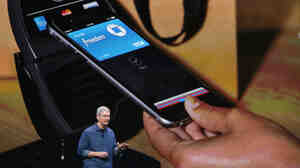 Apple CEO Tim Cook speaks in Cupertino, Calif., on Tuesday. The company unveiled a new mobile payment system called Apple Pay, which uses security built into the latest iPhones.