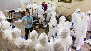 Nurses learn how to use Ebola protective gear in Sierra Leone