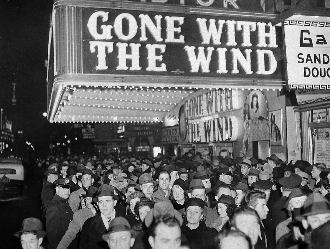 A crowd gathers outside the Astor Theater on Broadway during New York City's Gone with the Wind premiere in December 1939. A crowd gathers outside the Astor Theater on Broadway during New York City's Gone with the Wind premiere in December 1939.